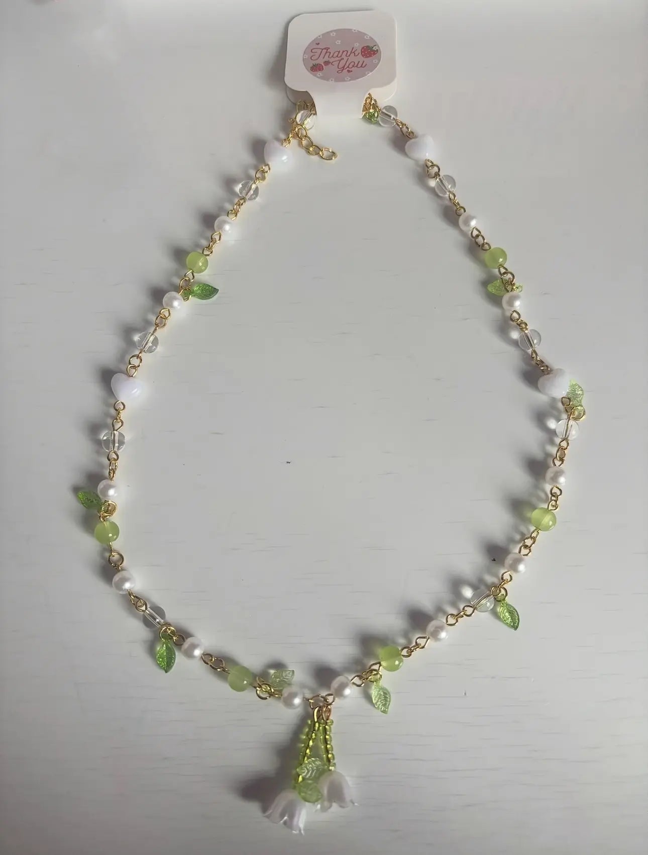 Necklace with beads and tassel on a white background